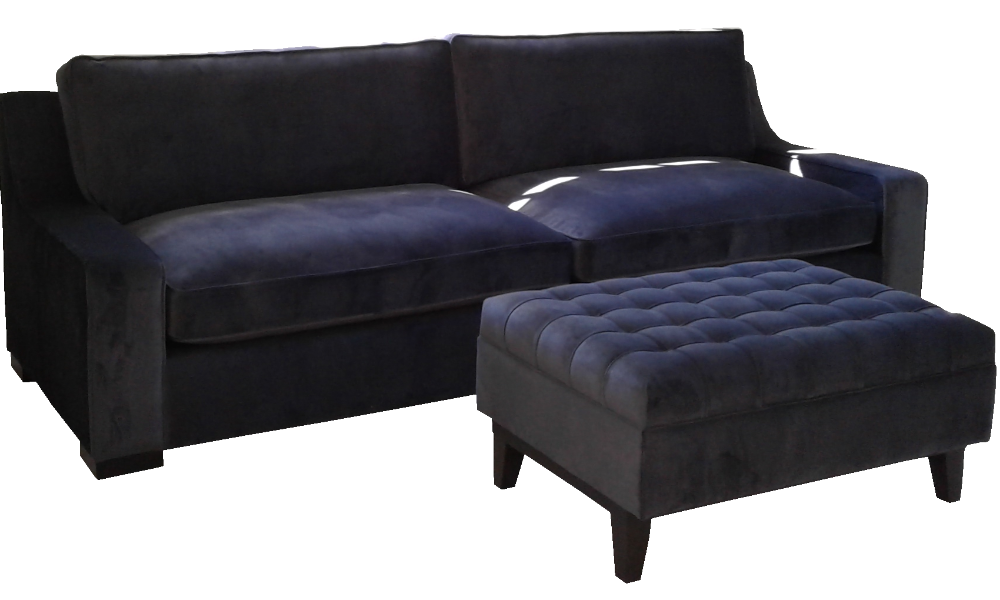 A dark blue 3-seater sofa with wide, sloped arms and deep pull squares footstool.