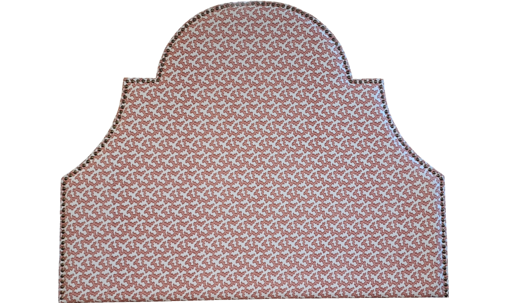 A red and grey round-shaped king headboard with decarative studs.